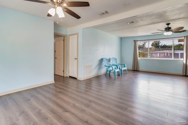 spare room with hardwood / wood-style flooring and ceiling fan