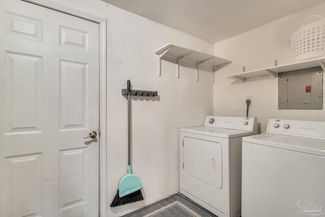 washroom with electric panel and washing machine and clothes dryer