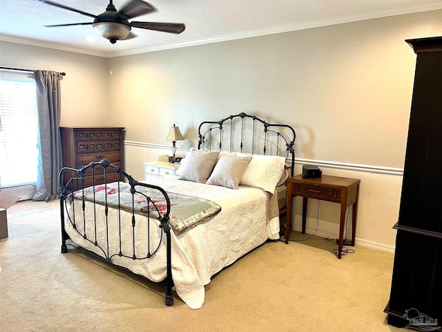 bedroom featuring ornamental molding, light carpet, and ceiling fan