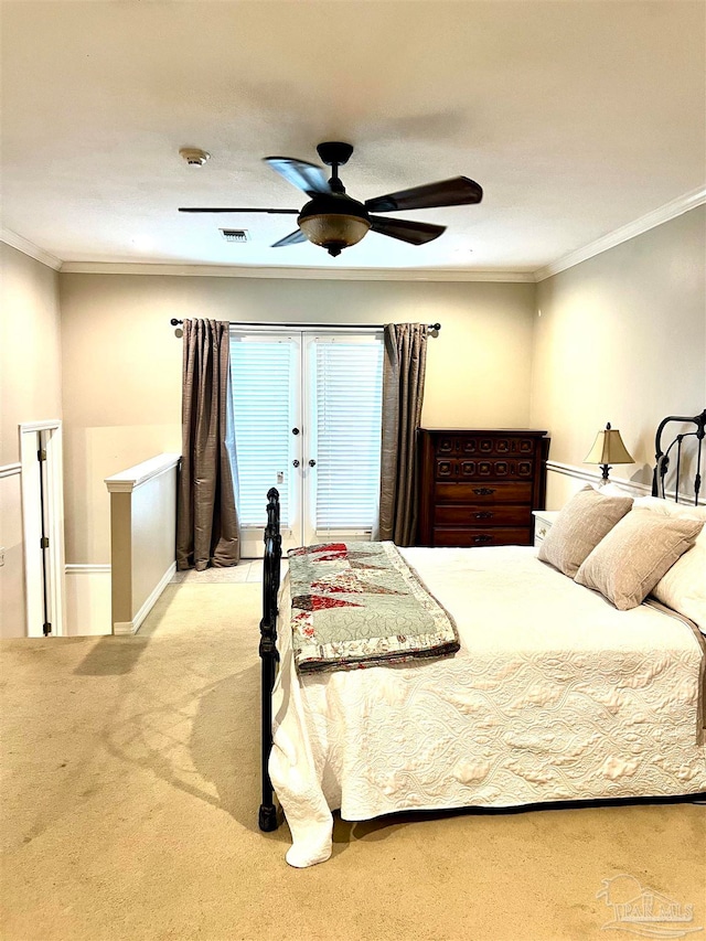 bedroom featuring ceiling fan, ornamental molding, and light colored carpet