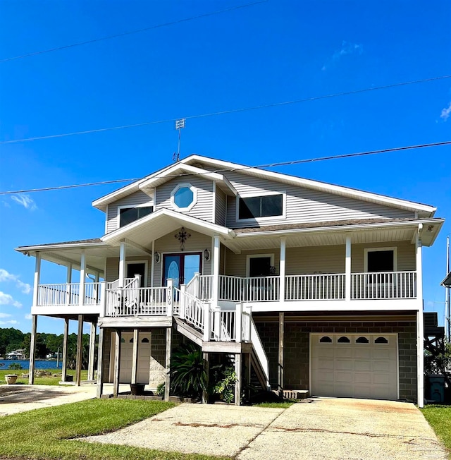 beach home with a garage and covered porch