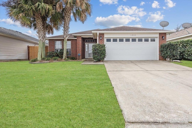 view of front of home featuring a garage and a front yard