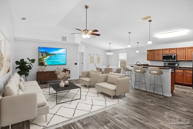 living room with sink, wood-type flooring, high vaulted ceiling, and ceiling fan