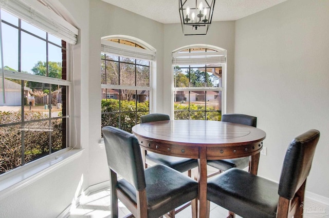 sunroom with a chandelier