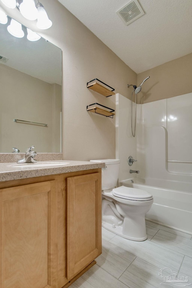 full bathroom featuring vanity, toilet, visible vents, and shower / bathtub combination