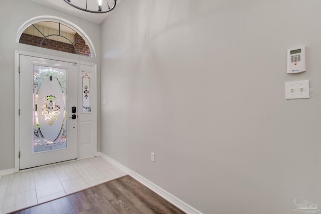 entryway with baseboards and light wood-style floors