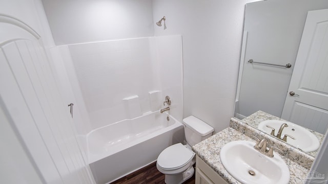 full bathroom featuring vanity, shower / bathing tub combination, hardwood / wood-style floors, and toilet