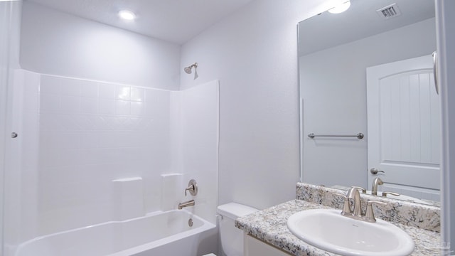 full bathroom with vanity, bathing tub / shower combination, and toilet