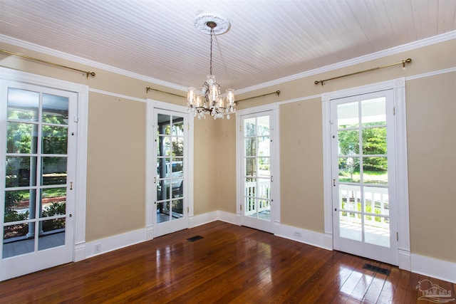 905 N Barcelona St, Pensacola, FL 32501 - unfurnished dining area featuring dark wood-style flooring, a chandelier, ornamental molding, and baseboards