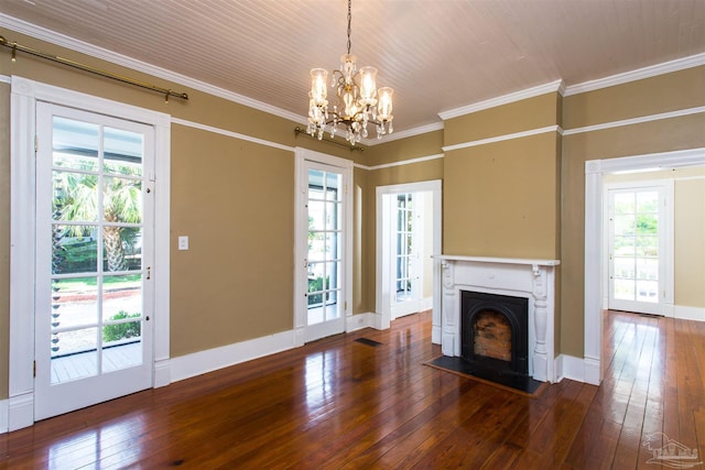 905 N Barcelona St, Pensacola, FL 32501 - unfurnished living room with hardwood / wood-style flooring, a chandelier, a fireplace, crown molding, and baseboards