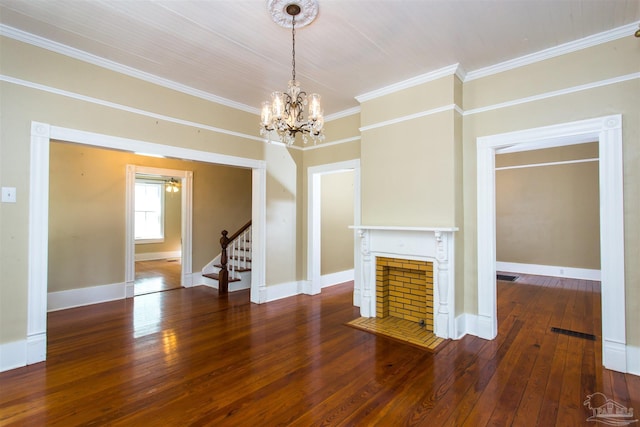 905 N Barcelona St, Pensacola, FL 32501 - unfurnished living room with wood-type flooring, stairway, ornamental molding, a chandelier, and a fireplace with flush hearth