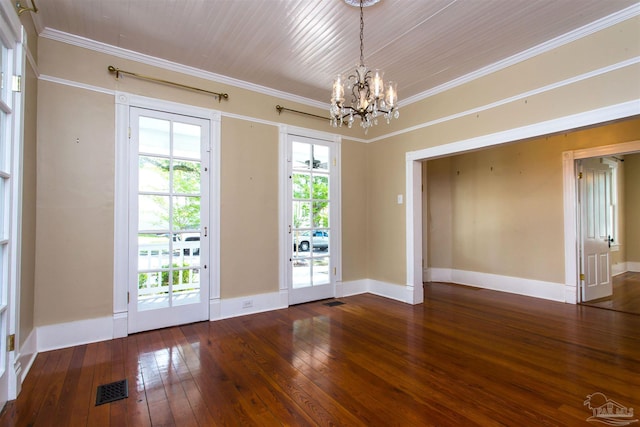 905 N Barcelona St, Pensacola, FL 32501 - empty room featuring hardwood / wood-style flooring, a chandelier, crown molding, and baseboards