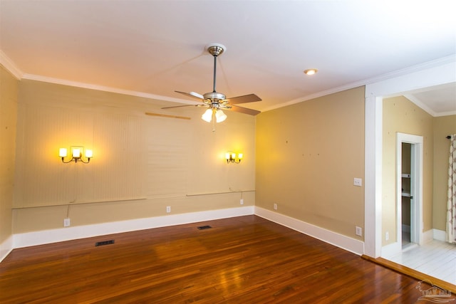 905 N Barcelona St, Pensacola, FL 32501 - spare room featuring wood finished floors, ceiling fan, crown molding, and baseboards