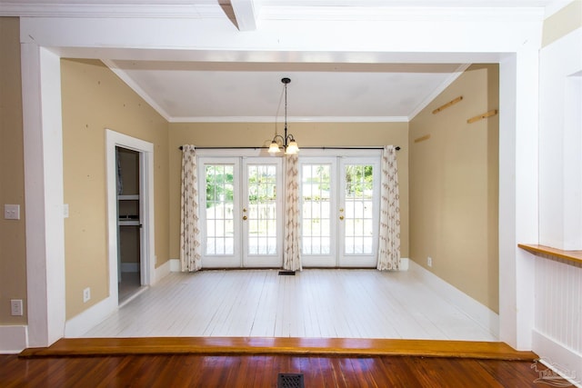 905 N Barcelona St, Pensacola, FL 32501 - unfurnished room featuring hardwood / wood-style floors, a chandelier, french doors, crown molding, and baseboards