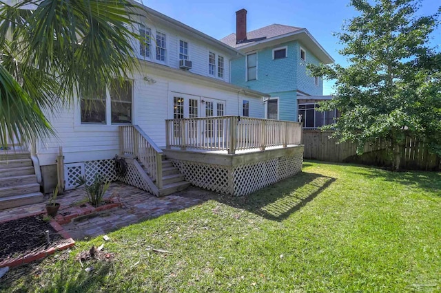 905 N Barcelona St, Pensacola, FL 32501 - back of house featuring a wooden deck and a chimney