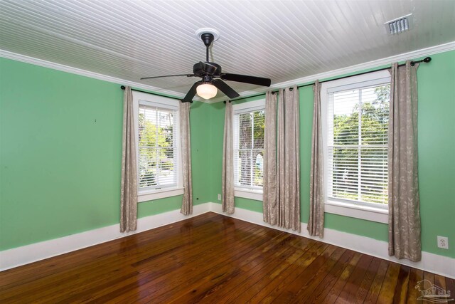 905 N Barcelona St, Pensacola, FL 32501 - spare room featuring baseboards, hardwood / wood-style floors, and ceiling fan