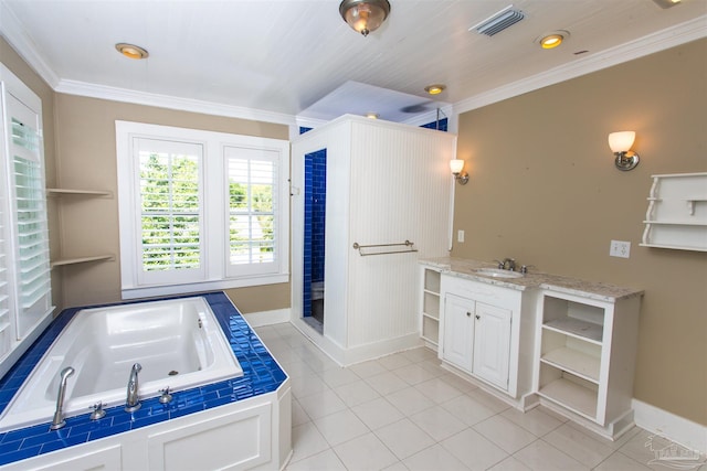905 N Barcelona St, Pensacola, FL 32501 - full bath featuring tile patterned floors, a garden tub, ornamental molding, baseboards, and vanity