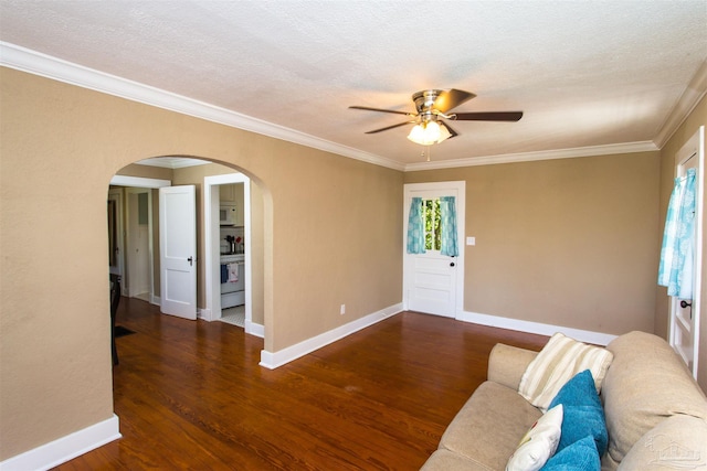 905 N Barcelona St, Pensacola, FL 32501 - living room with arched walkways, ceiling fan, ornamental molding, wood finished floors, and baseboards