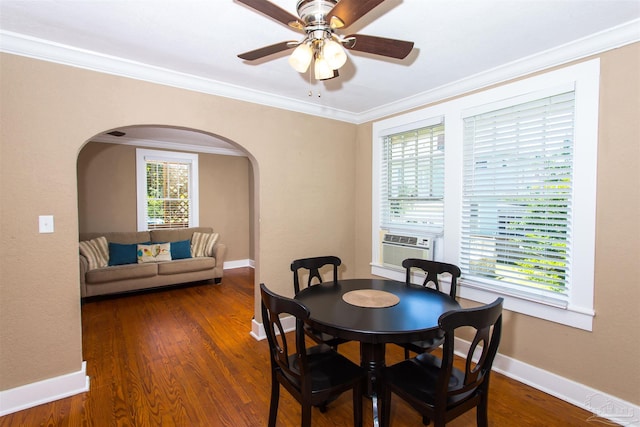 905 N Barcelona St, Pensacola, FL 32501 - dining room with arched walkways, a ceiling fan, ornamental molding, wood finished floors, and cooling unit