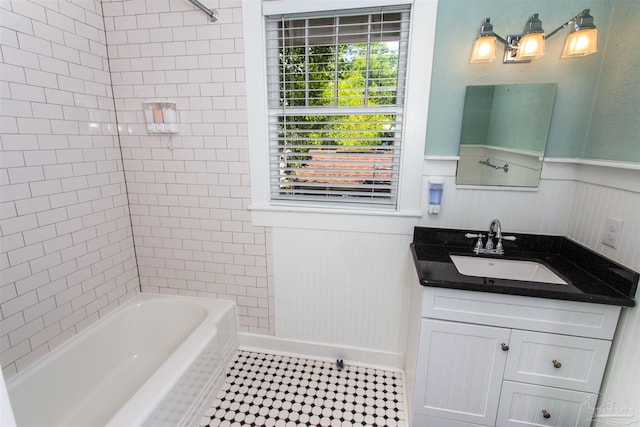 905 N Barcelona St, Pensacola, FL 32501 - full bath featuring shower / bath combination, wainscoting, and vanity