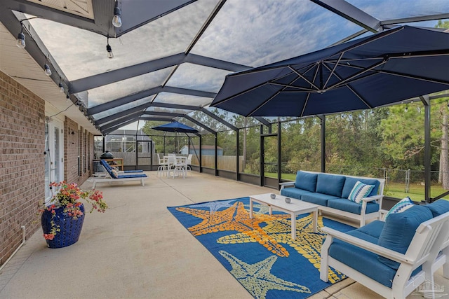 view of patio / terrace with outdoor lounge area and a lanai