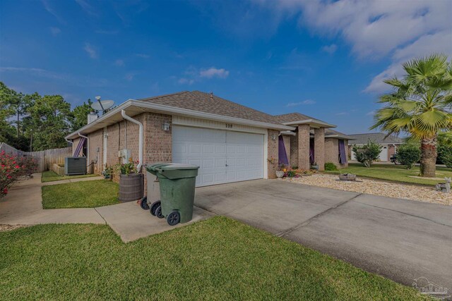 single story home featuring a garage, central air condition unit, and a front lawn