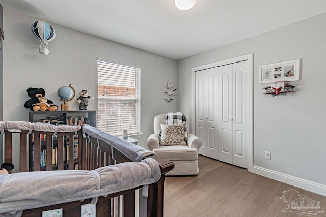 bedroom with a closet and light wood-type flooring