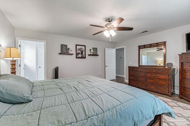 bedroom with light hardwood / wood-style floors and ceiling fan