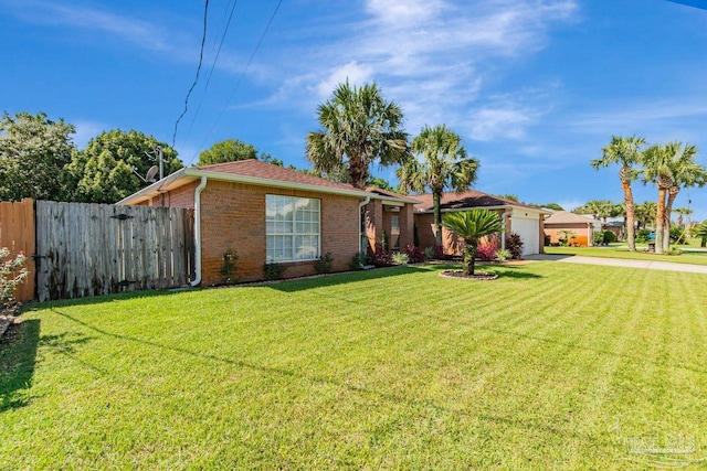 single story home featuring a front yard and a garage