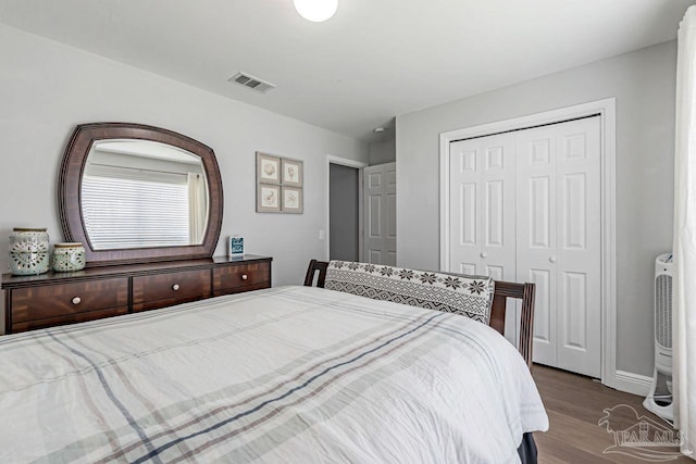 bedroom featuring a closet and light wood-type flooring