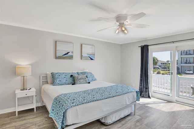 bedroom featuring hardwood / wood-style floors, ceiling fan, crown molding, and access to outside