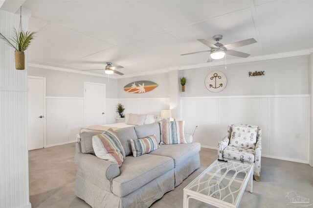 living room featuring ceiling fan and light colored carpet