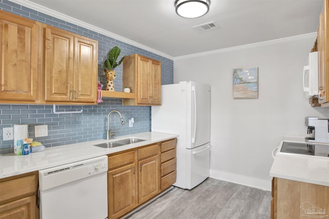 kitchen with white appliances, crown molding, sink, decorative backsplash, and light wood-type flooring