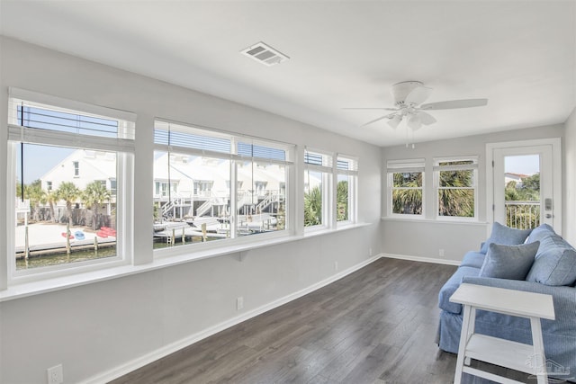 sunroom / solarium with ceiling fan