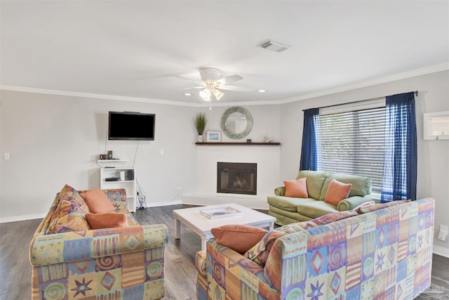 living room with ceiling fan, dark hardwood / wood-style flooring, and crown molding