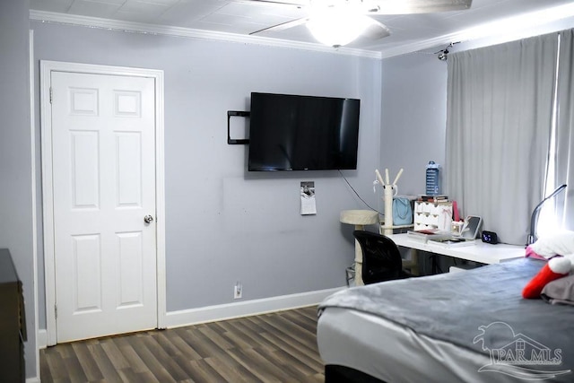 bedroom with ceiling fan, baseboards, dark wood finished floors, and crown molding