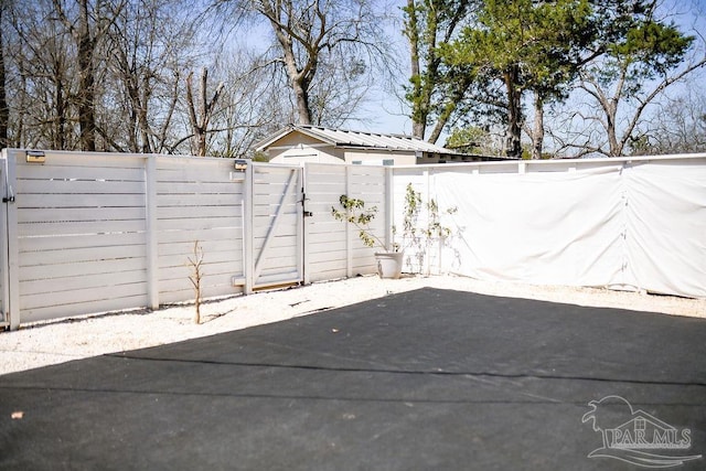 view of patio / terrace with fence and a gate