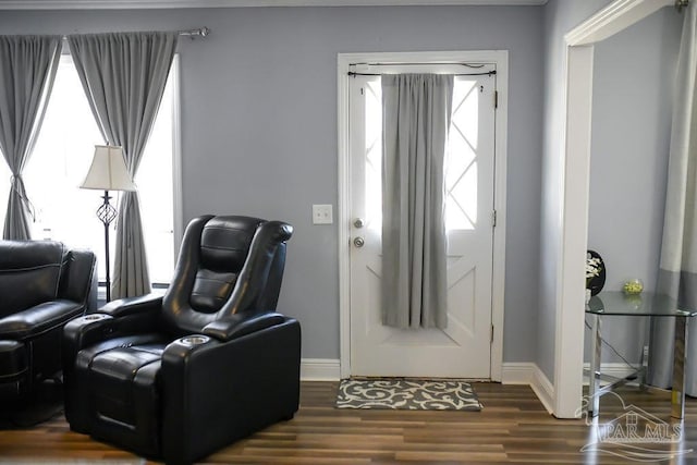 foyer with wood finished floors and baseboards