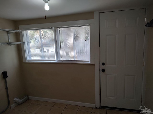 doorway to outside featuring light tile patterned floors