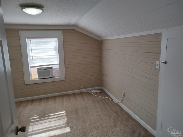 bonus room with lofted ceiling, carpet floors, cooling unit, and wood walls