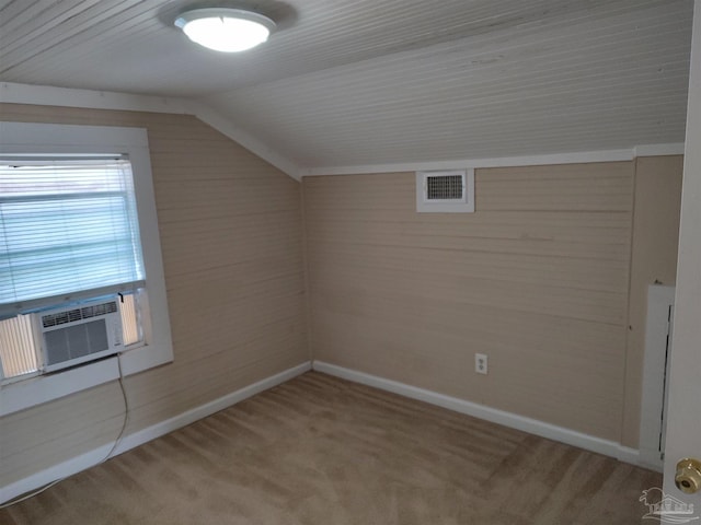 additional living space featuring lofted ceiling, carpet floors, and cooling unit