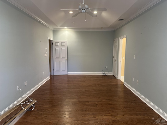 unfurnished room with dark wood finished floors, visible vents, ornamental molding, ceiling fan, and baseboards