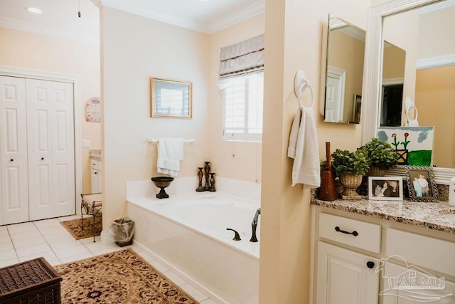 bathroom with vanity, a tub to relax in, crown molding, and tile patterned flooring