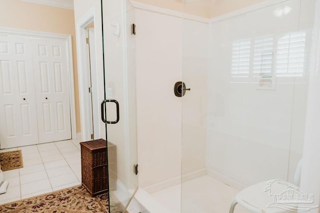 bathroom featuring tile patterned flooring and a shower stall