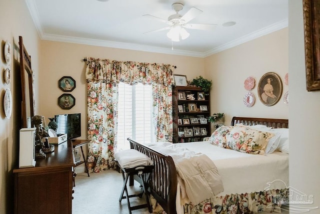 bedroom featuring a ceiling fan, carpet, and crown molding