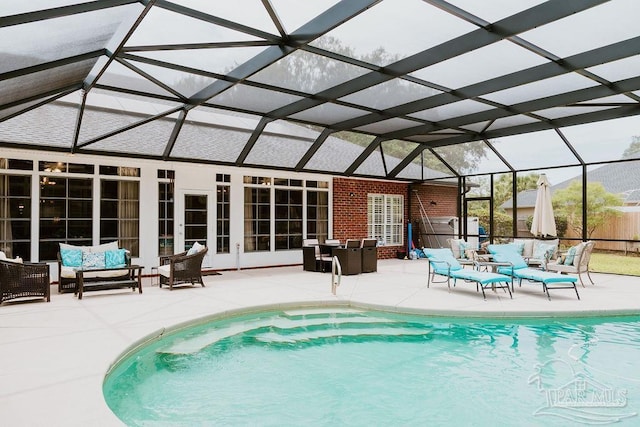 view of swimming pool with a fenced in pool, glass enclosure, a patio area, and an outdoor living space