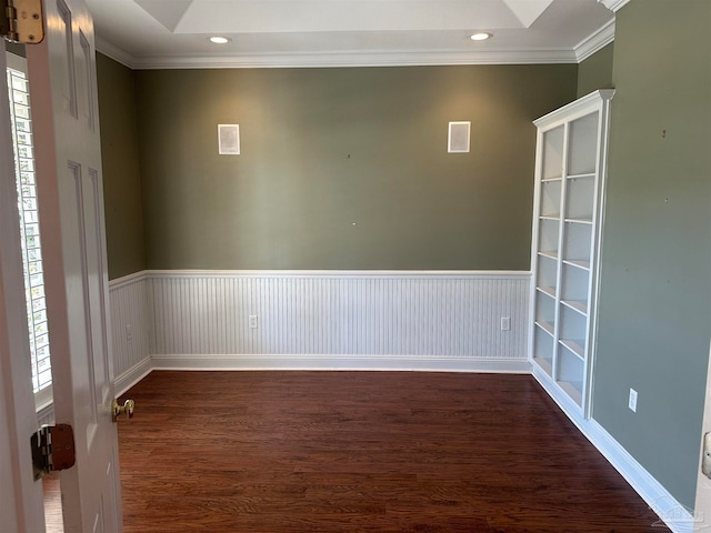 unfurnished room with crown molding and dark hardwood / wood-style floors