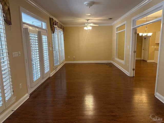 spare room featuring ceiling fan with notable chandelier, crown molding, and dark hardwood / wood-style floors