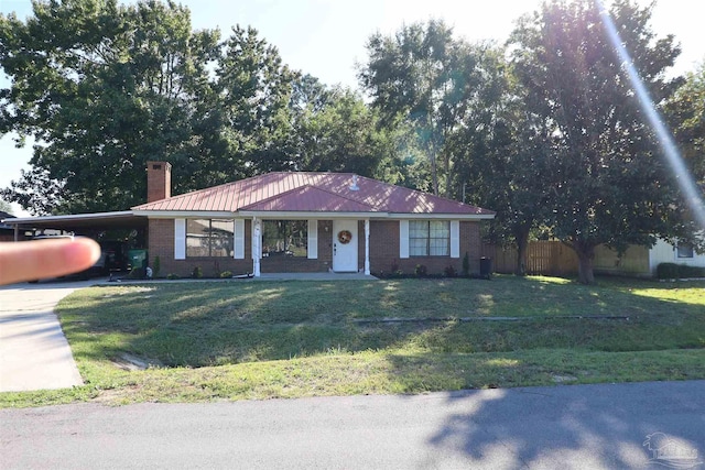 ranch-style home with a carport and a front yard