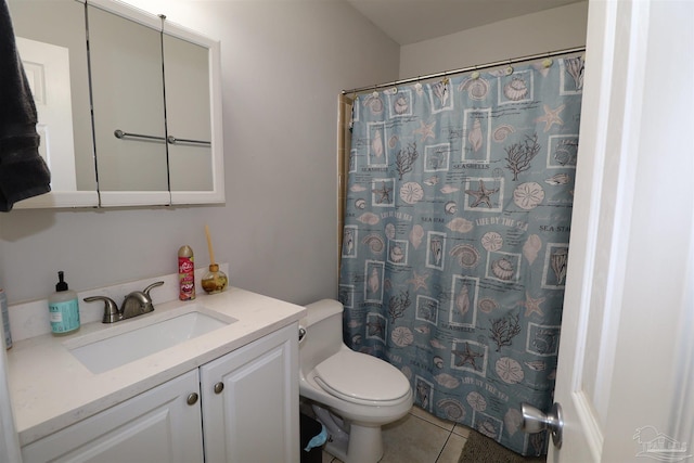 bathroom with toilet, vanity, tile patterned flooring, and curtained shower